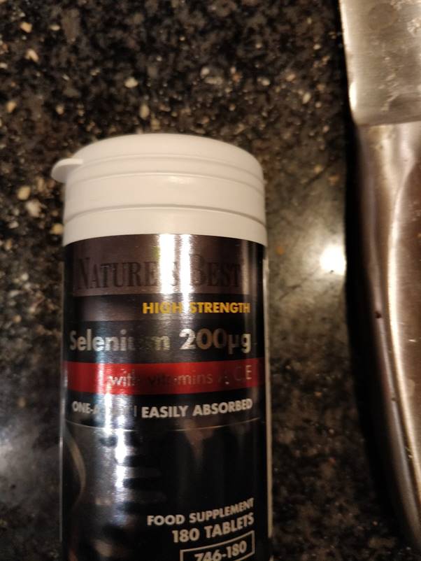 A bottle of liquid  Description automatically generated with low confidence