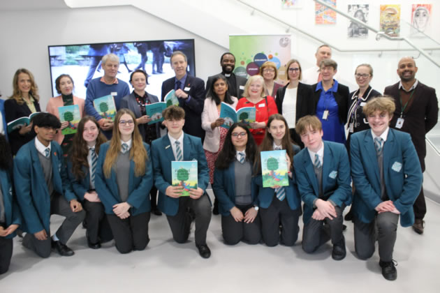 Staff and students of Ada Lovelace with the new book along with Rupa Huq MP 
