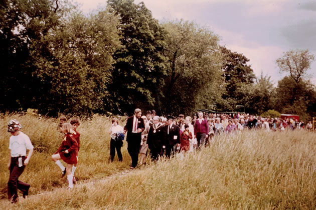 Luke FitzHerbert leads a walk on the newly opened Brent River Park footpath through Brent Meadow (29 June 1975)