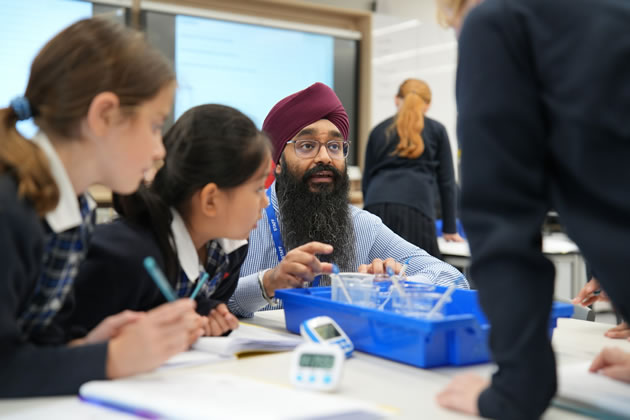Science teacher Mr Ghajinder Bansal with students