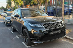 Range Rover with Disappearing Plates Gets Towed
