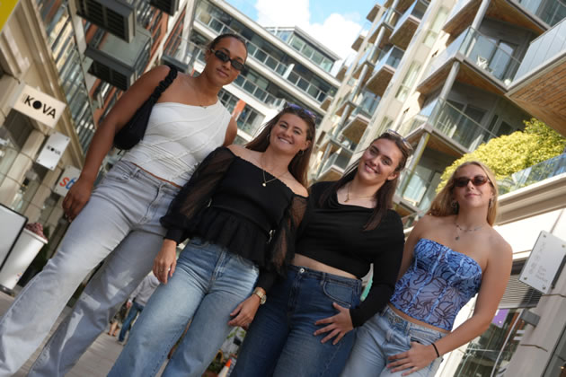 Four players take part in a photo shoot on Ealing Broadway