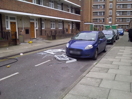 The frame of the kitchen window on the road below the fire