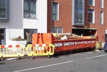 20-cubic-yard skip left on Gunnersbury Lane by Ron Smith Recycling Limited without a licence